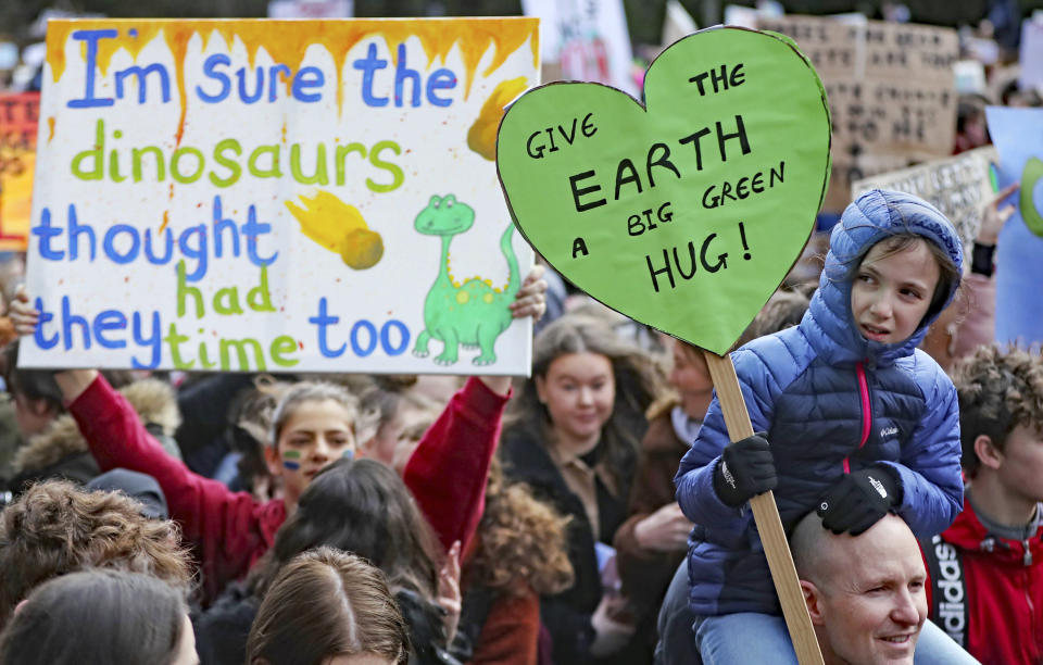 Thousands of students march from St Stephens Green to Leinster House, Dublin, Friday March 15, 2019. Students mobilized by word of mouth and social media skipped class Friday to protest what they believe are their governments’ failure to take though action against global warming. (Niall Carson//PA via AP)