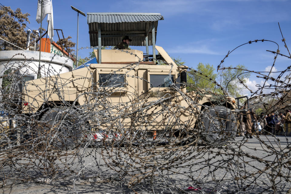 Taliban fighters stand guard at the explosion site, near the Foreign Ministry in Kabul, Afghanistan, Monday, March 27, 2023. A suicide bomber has struck near the foreign ministry in the Afghan capital, killing at least six people and wounding about a dozen. (AP Photo/Ebrahim Noroozi)