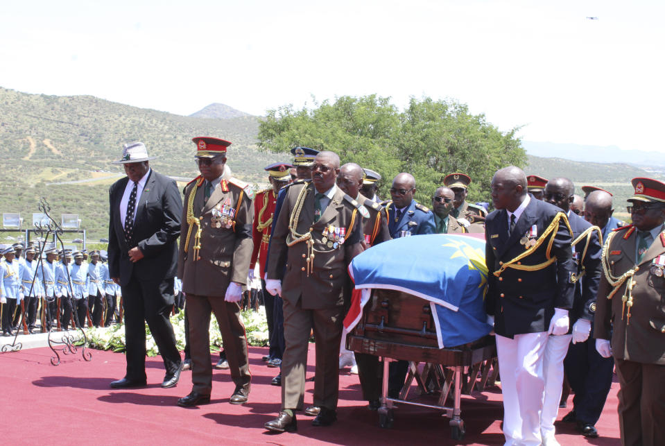 Pallbearers carry the flag-draped coffin of the late Namibian President Hage Geingob during his funeral service in Windhoek, Namibia, Sunday, Feb. 25, 2024. (AP Photo/Esther Mbathera).