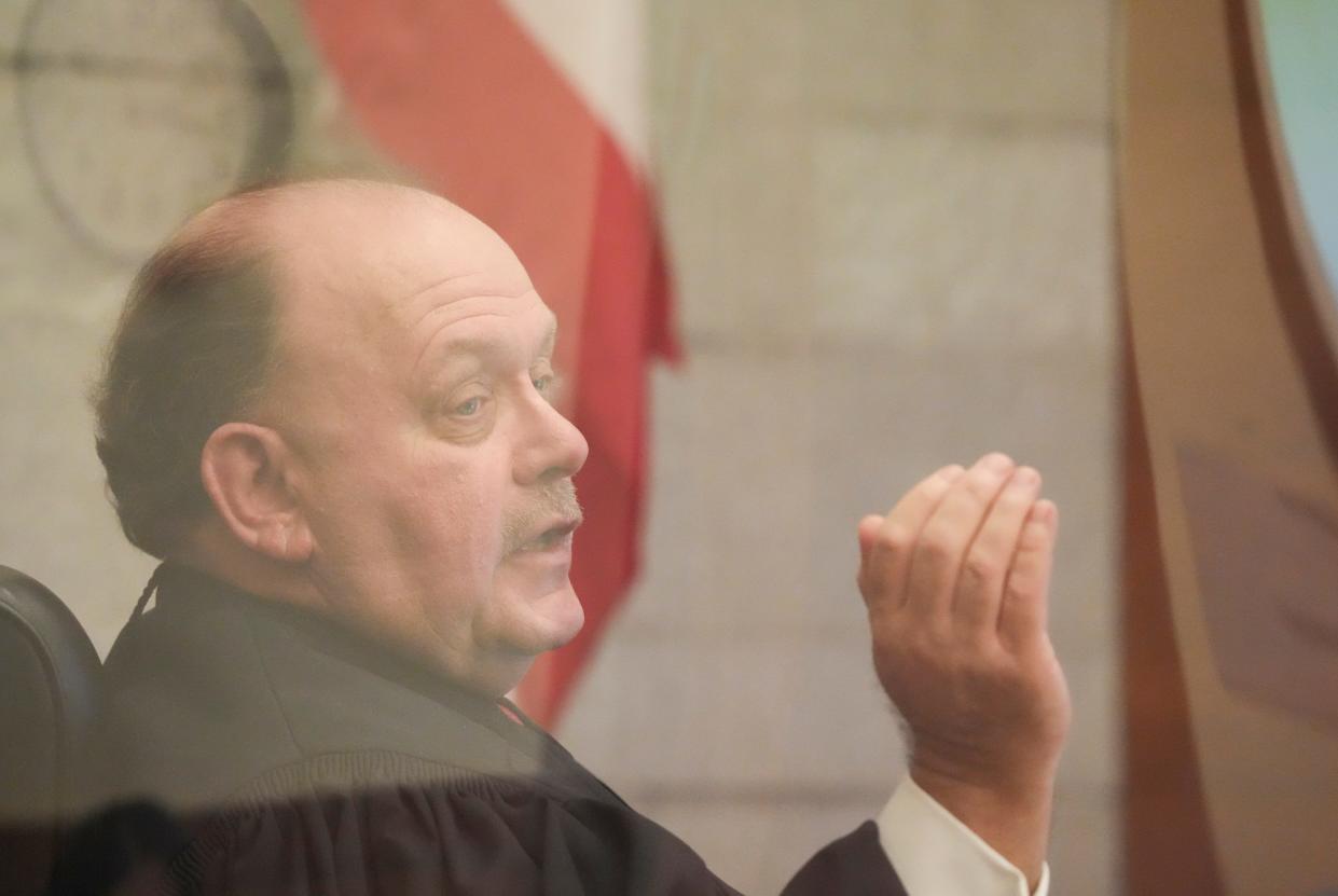 Franklin County Common Pleas Judge Michael J. Holbrook speaks during a Dec. 1, pre-trial hearing in the case of former doctor William Husel, who was indicted in 2019 on 25 murder counts related to patient deaths at Mount Carmel Health hospitals, where he worked as an intensive-care physician. Holbrook will preside over a Thursday hearing at which prosecutors are expected to seek the dismissal of some counts.