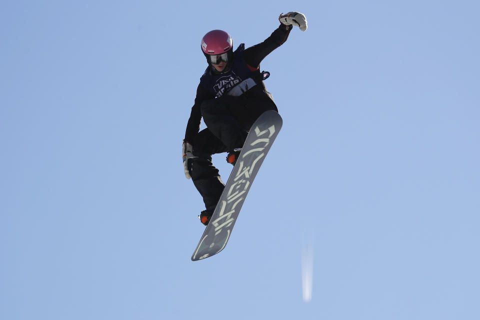 A snowboarder practices for the Big Air Atlanta snowboard and ski competition at SunTrust Park Thursday, Dec. 19, 2019, in Atlanta. (AP Photo/John Bazemore)