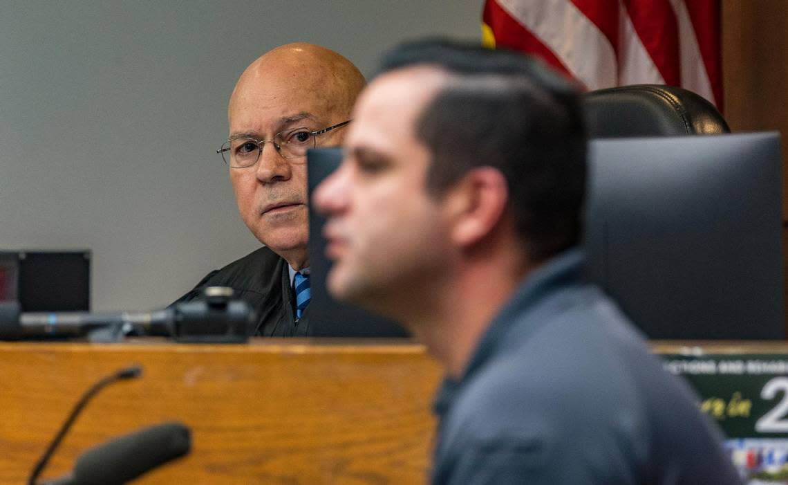 Judge Alberto Milian listens as Detective C. Ugalde gets cross-examined by a defense attorney during a pretrial hearing of defendant Oscar Olea, who has been charged with two counts of sexual battery after allegedly having an inappropriate relationship with two young girls, at the Gerstein Justice Building in Miami on Thursday, March 7, 2024. Pedro Portal/pportal@miamiherald.com