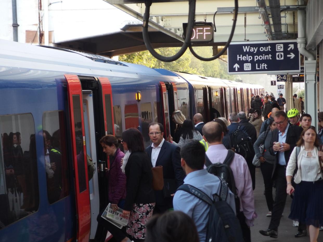 Standing innovation: Rush-hour commuters will be able to use a smartphone app to find the best place to stand on the platform at stations such as Surbiton: Simon Calder