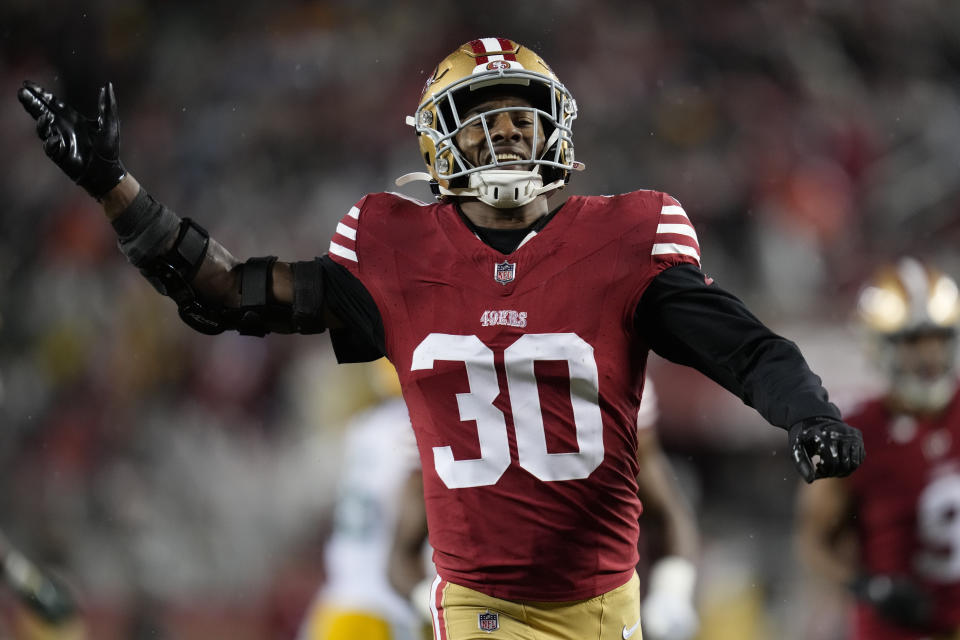 FILE - San Francisco 49ers safety George Odum (30) hypes up the crowd on a kick return during an NFL football game against the Green Bay Packers Sunday, Jan. 21, 2024, in Inglewood, Calif. The San Francisco 49ers have agreed to a two-year extension with special teams standout Odum that will keep him under contract through the 2026 season. Odum's agent, Matt Glose, said the deal reached Tuesday, March 12, will be worth up to $10 million for the two seasons. (AP Photo/Ashley Landis, File)