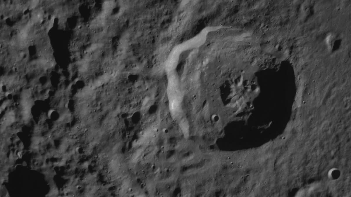  A close-up of the lunar surface showing a crater. 