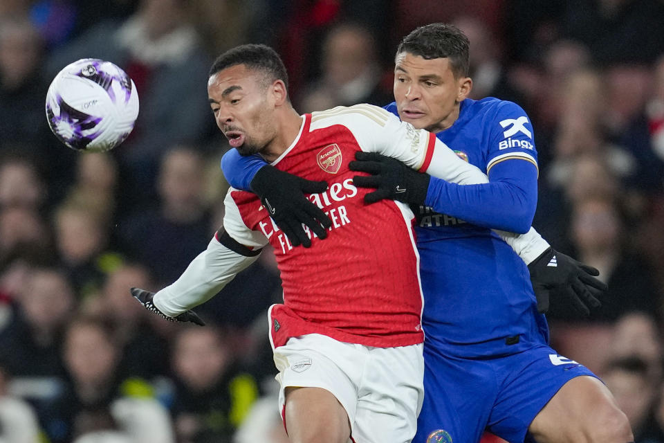 Arsenal's Gabriel Jesus, left, duels for the ball with Chelsea's Thiago Silva during the English Premier League soccer match between Arsenal and Chelsea at Emirates Stadium in London, Tuesday, April 23, 2024. (AP Photo/Kin Cheung)