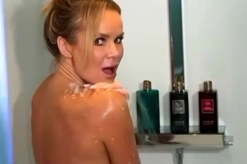 Amanda Holden in a shower as part of a promotional video for a brand.