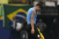 Uruguay's Luis Suarez leaves the field after losing 4-1 against Brazil at the end of a qualifying soccer match for the FIFA World Cup Qatar 2022 at Arena da Amazonia in Manaus, Brazil, Thursday, Oct.14, 2021. (AP Photo/Andre Penner)