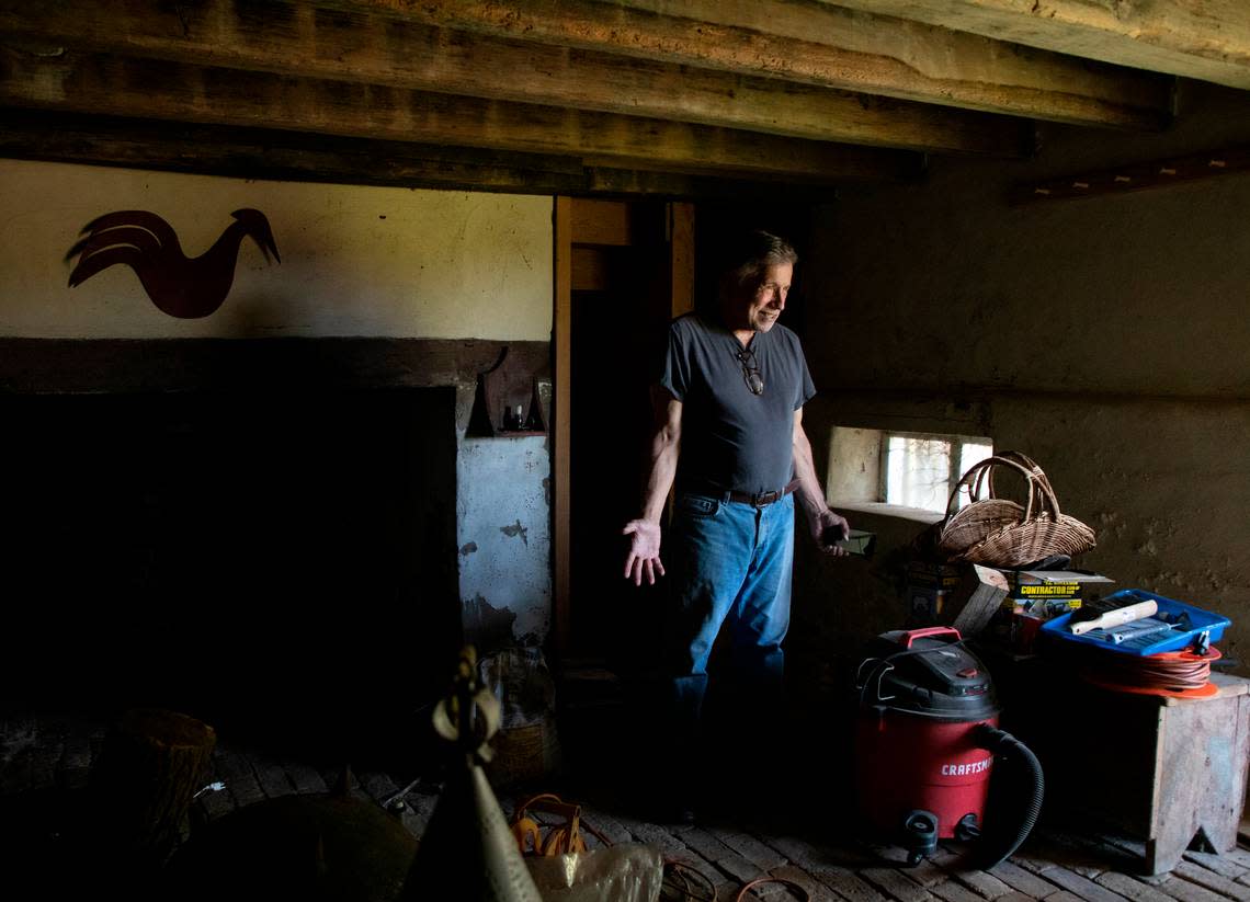 Bob Tucci smiles as he stands in the winter kitchen of the Duke-Lawrence House near Rich Square, N.C., on June 15, 2022. Tucci is restoring the home, one of the oldest in North Carolina.