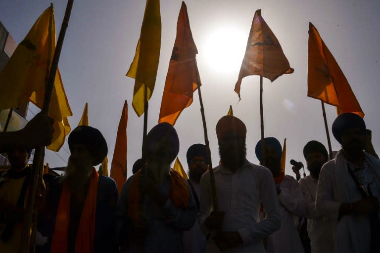 <p>Indian Dal Khalsa Sikh organisation activists hold flags and placards during a protest march ahead of the 32nd anniversary of Operation Blue Star in Amritsar on June 3, 2016. The Indian military’s 1984 assault on the Golden Temple in Amritsar, called Operation Blue Star, was aimed at flushing out militants holed up inside demanding an independent Sikh homeland. The struggle culminated in the deadly storming of the Golden Temple, Sikhism’s holiest shrine. </p>