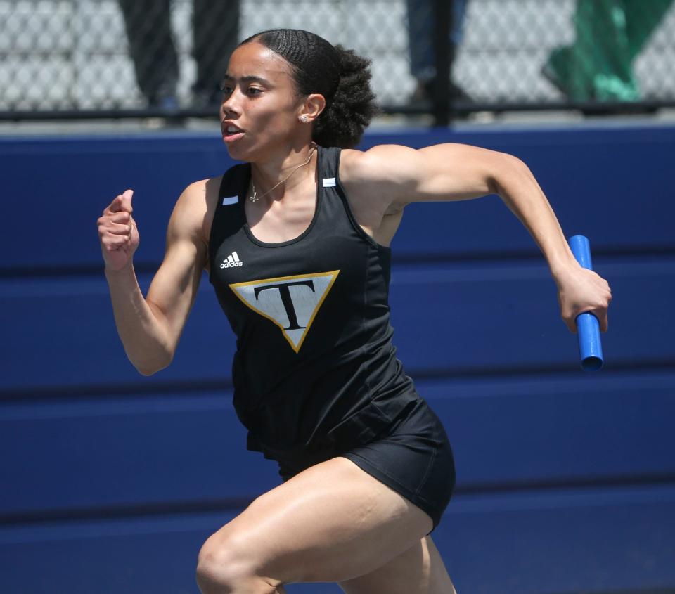 Tatnall's Arianna Montgomery takes the baton to the finish as the Hornets win the 4x100 meter race during the New Castle County track and field championships, Saturday, May 11, 2024 at Abessinio Stadium.