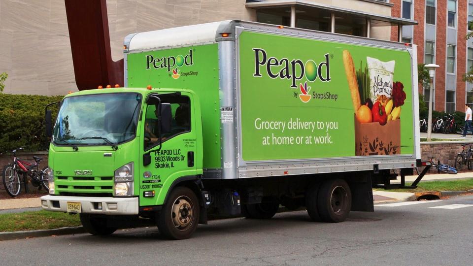 PRINCETON, NJ -14 OCTOBER 2015- A green Peapod by Stop and Shop truck is making a grocery delivery in New Jersey.