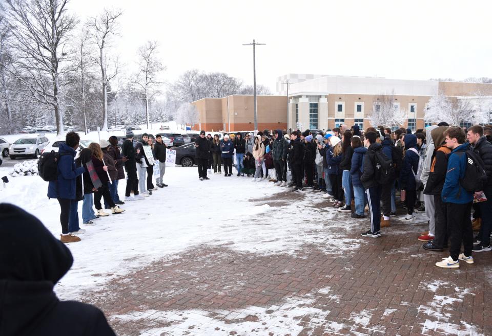 Students at East Lansing High School demonstrate in front of the school during a walkout to raise their voices against school violence, Thursday, Jan. 26, 2023.