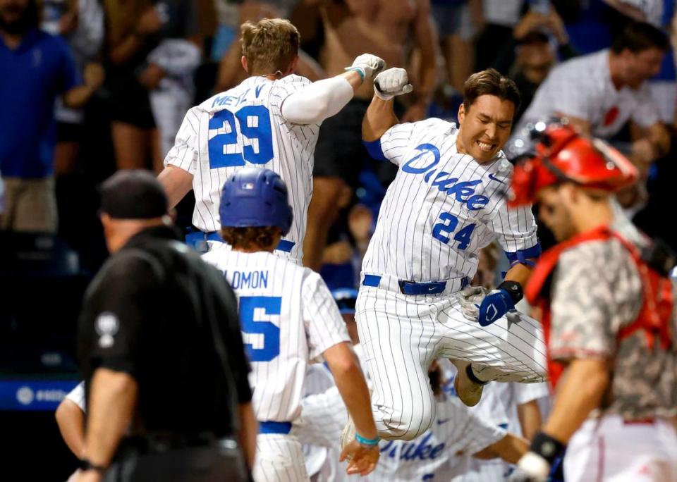 Duke’s MJ Metz (29) celebrates with Chad Knight (24) after Metz hit a two-run home run in the bottom of the ninth during N.C. State’s 8-7 victory over Duke in 11 innings during their game in the ACC Baseball Championship at the Durham Bulls Athletic Park in Durham, N.C., Tuesday, May 23, 2023.
