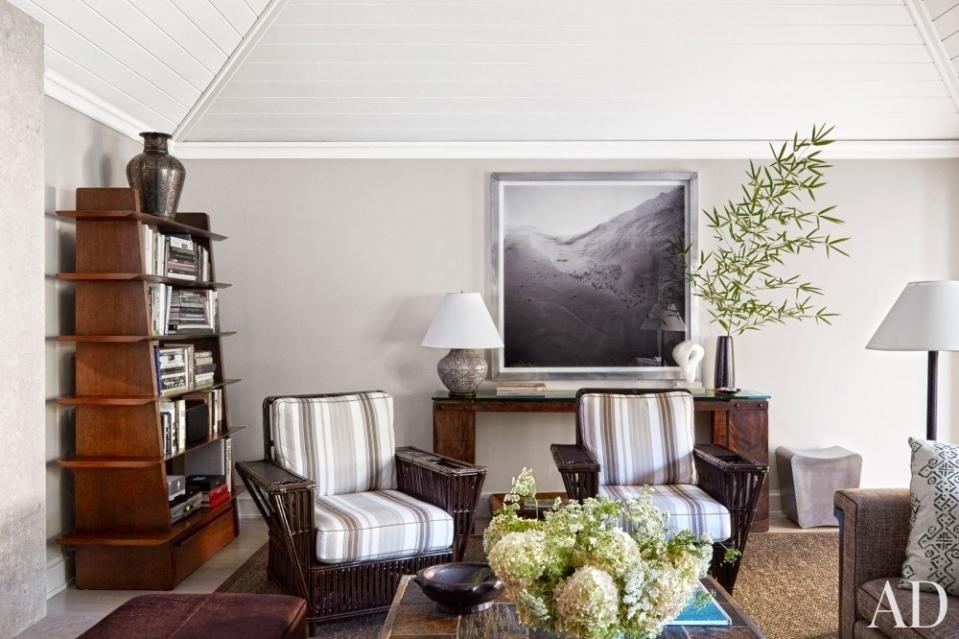 <p>In the designer David Kleinberg’s <a rel="nofollow noopener" href="https://www.architecturaldigest.com/story/david-kleinberg-renovated-hamptons-ranch-house-article?mbid=synd_yahoo_rss" target="_blank" data-ylk="slk:Hamptons sitting room;elm:context_link;itc:0;sec:content-canvas" class="link ">Hamptons sitting room</a>, painted in Fog Mist by Benjamin Moore, a Darren Almond photograph hangs above a vintage console topped by a 1950s French lamp; the walnut bookcase is by David Kleinberg Design Assoc., and the Bielecky Brothers wicker chairs are cushioned in a Zimmer + Rohde stripe.</p> <p><strong>Related:</strong> <a rel="nofollow noopener" href="https://www.architecturaldigest.com/decorating-with-color?mbid=synd_yahoo_rss" target="_blank" data-ylk="slk:AD’s Guide to Decorating with Color;elm:context_link;itc:0;sec:content-canvas" class="link "><em>AD</em>’s Guide to Decorating with Color</a></p>