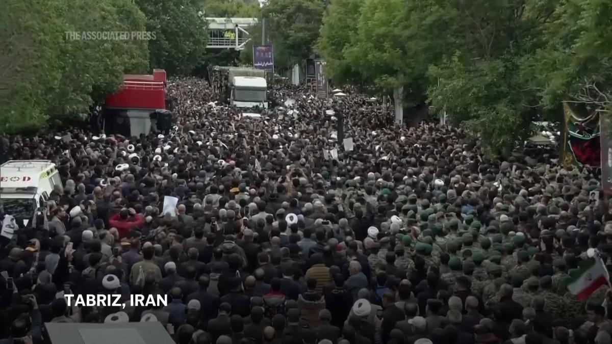 Crowd of mourners surrounds truck carrying remains of Iran president and officials killed in chopper crash – Yahoo! Voices