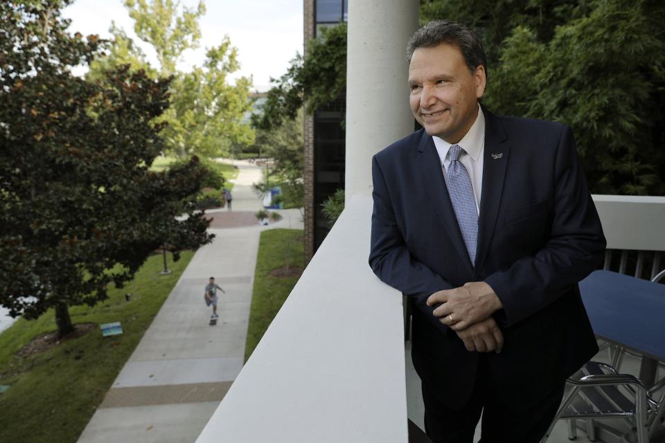 UNF's new president Moez Limayem overlooks a portion of the campus from the balcony of his office Thursday, August 25, 2022.