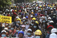 Protesters flash a three-fingered sign of resistance during a demonstration against the Feb. 1 military coup in Mandalay, Myanmar, Saturday, March 6, 2021. The U.N. special envoy for Myanmar on Friday called for urgent Security Council action, saying about 50 peaceful protesters were killed and scores were injured in the military's worst crackdowns this week. (AP Photo)