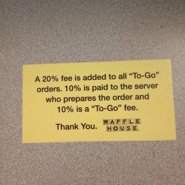 A Waffle House sign says there will be a 20% fee on all to-go orders — 10% will go to the server, and 10% is a "to-go fee"