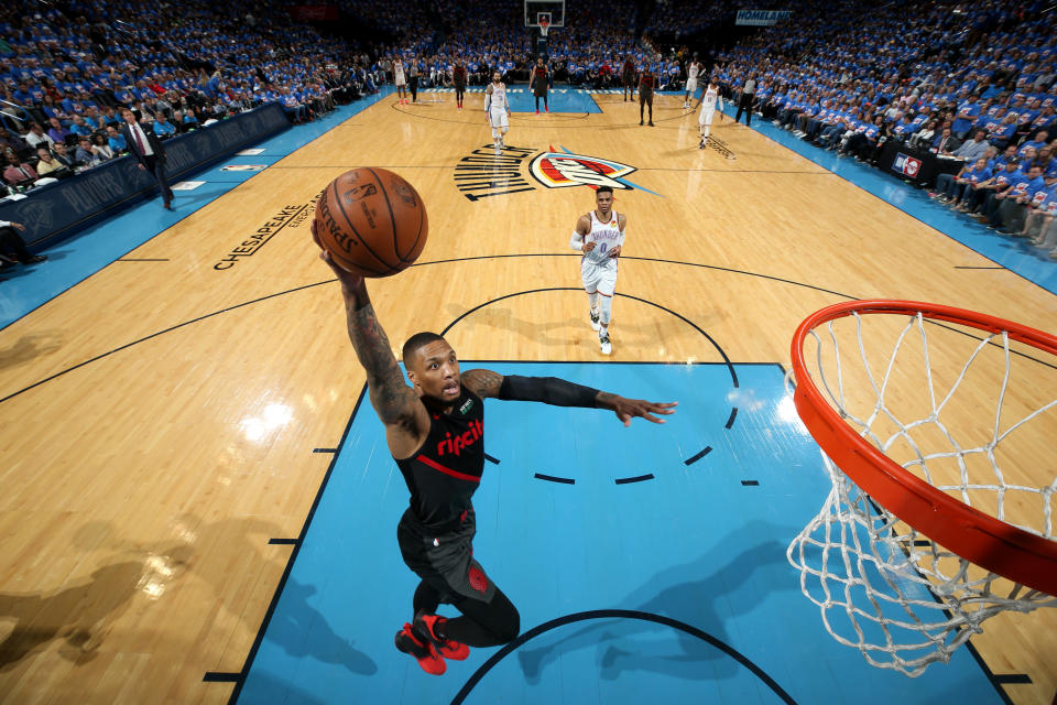 OKLAHOMA CITY, OK - APRIL 21: Damian Lillard #0 of the Portland Trail Blazers dunks the ball during the game against the Oklahoma City Thunder during Game Four of Round One of the 2019 NBA Playoffs on April 21, 2019 at Chesapeake Energy Arena in Oklahoma City, Oklahoma. NOTE TO USER: User expressly acknowledges and agrees that, by downloading and/or using this photograph, user is consenting to the terms and conditions of the Getty Images License Agreement. Mandatory Copyright Notice: Copyright 2019 NBAE (Photo by Zach Beeker/NBAE via Getty Images)