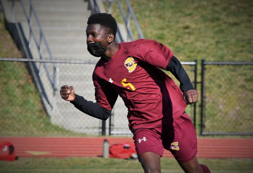 Case boys soccer player Gaoussou Traore celebrates after scoring a goal in a 2021 game against Old Rochester.