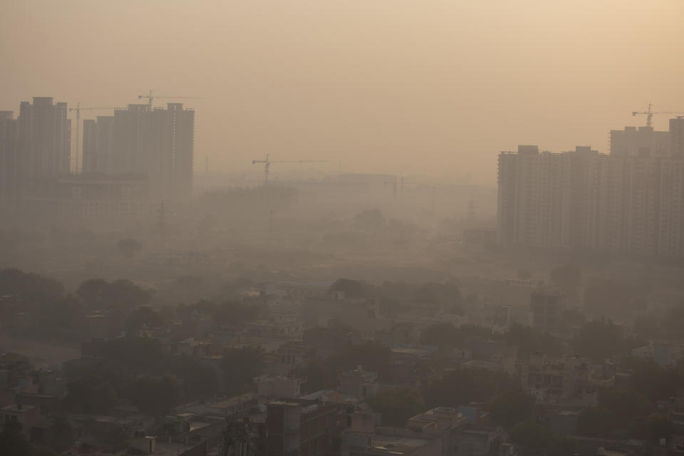 Morning haze envelops the skyline on the outskirts of New Delhi, India, Friday, Oct. 16, 2020. The Indian capital’s air quality levels plunged to “very poor” on Friday, days after the state government initiated stricter measures to fight chronic air pollution. A smoggy haze settled over the city, reducing visibility, as the Air Quality Index rose past 270, according to SAFAR, India’s main environment monitoring agency. The World Health Organization deems anything above 25 as unsafe. (AP Photo/Altaf Qadri)