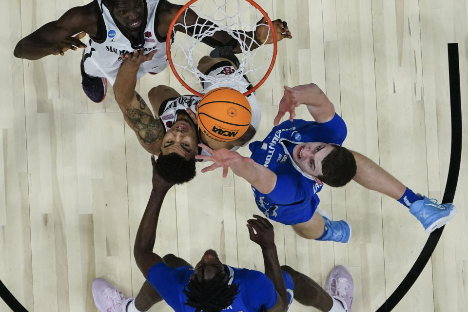 Creighton center Ryan Kalkbrenner (11) shoots against San Diego State guard Matt Bradley (20) in the second half of a Elite 8 college basketball game in the South Regional of the NCAA Tournament, Sunday, March 26, 2023, in Louisville, Ky. (AP Photo/John Bazemore)