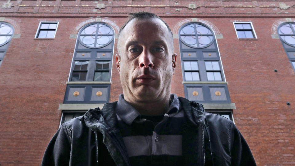 David Meehan, lead plaintiff in a class-action lawsuit accusing the State of New Hampshire of covering up decades of sexual, physical and emotional abuse at its youth detention center, poses outside his lawyer's office in Portsmouth, N.H., Friday, Jan. 10, 2020. Meehan accuses three staffers, one who later worked for the Boston Red Sox, of sexually assaulting him, and others of witnessing and enabling the abuse. (AP Photo/Charles Krupa)