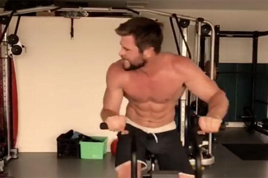 <p>Chris can work-out shirtless ANYTIME. Those arms.... those abs! Is it hot in here or is that just us?</p>