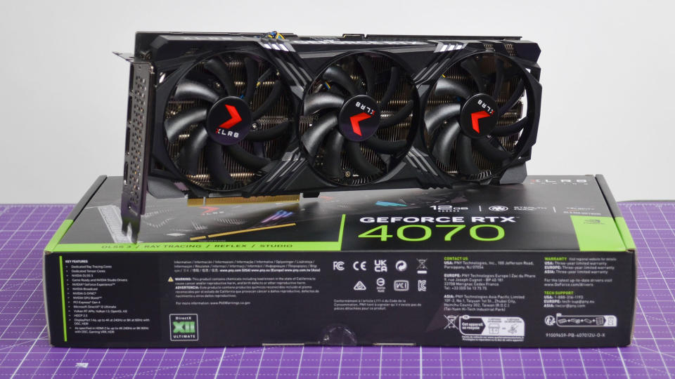 A PNY GeForce RTX 4070 XLR8 OC graphics card on a purple desk mat