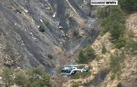 A rescue helicopter from the French Gendarmerie hovers in front of the crash site of an Airbus A320, near Seyne-les-Alpes, March 24, 2015 in this still image taken from TV. REUTERS/BFM via Reuters TV