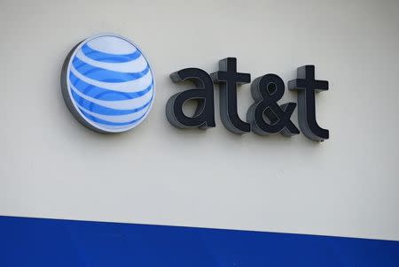 The AT&T logo is pictured by its store in Carlsbad, California, April 22, 2013. REUTERS/Mike Blake