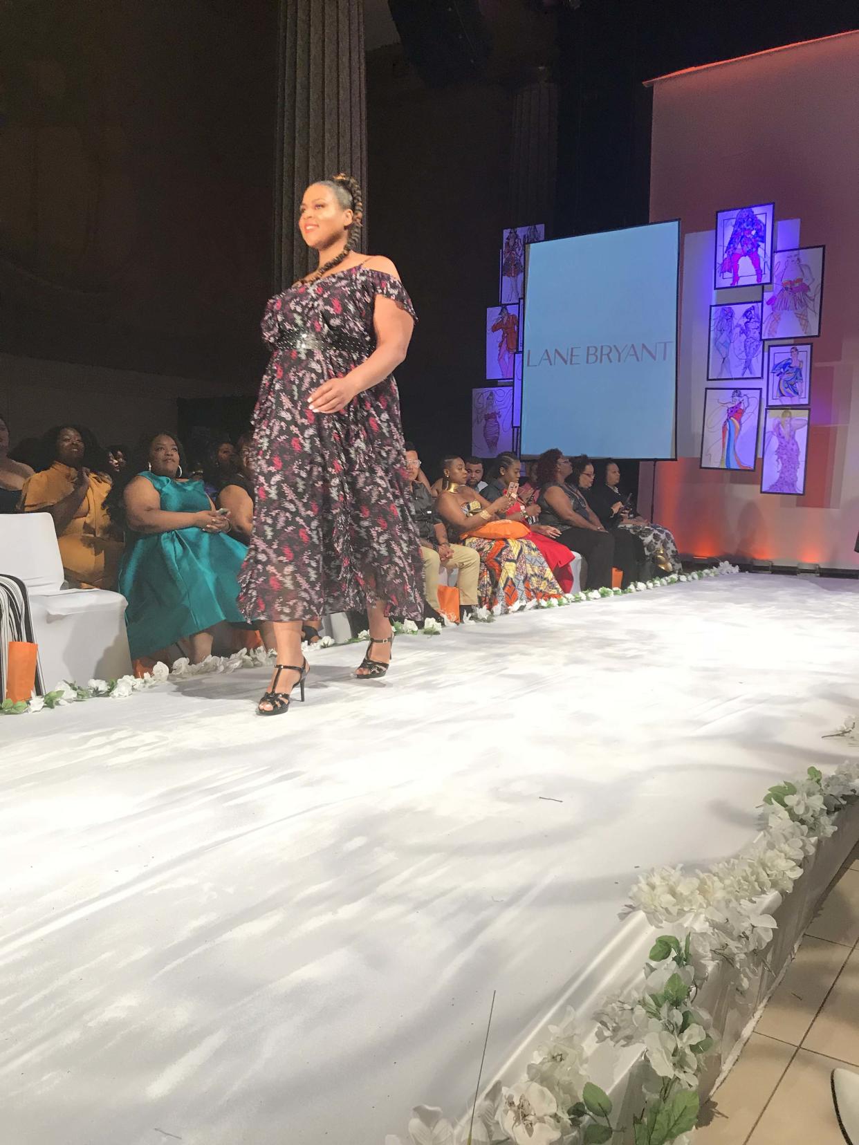 A model wears a floral off-the-shoulder dress by Lane Bryant at Full Figured Fashion Week’s finale in New York City. (Photo: Courtesy of Lane Bryant/Cacique)