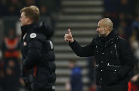 Britain Football Soccer - AFC Bournemouth v Manchester City - Premier League - Vitality Stadium - 13/2/17 Manchester City manager Pep Guardiola and Bournemouth manager Eddie Howe Reuters / Peter Nicholls