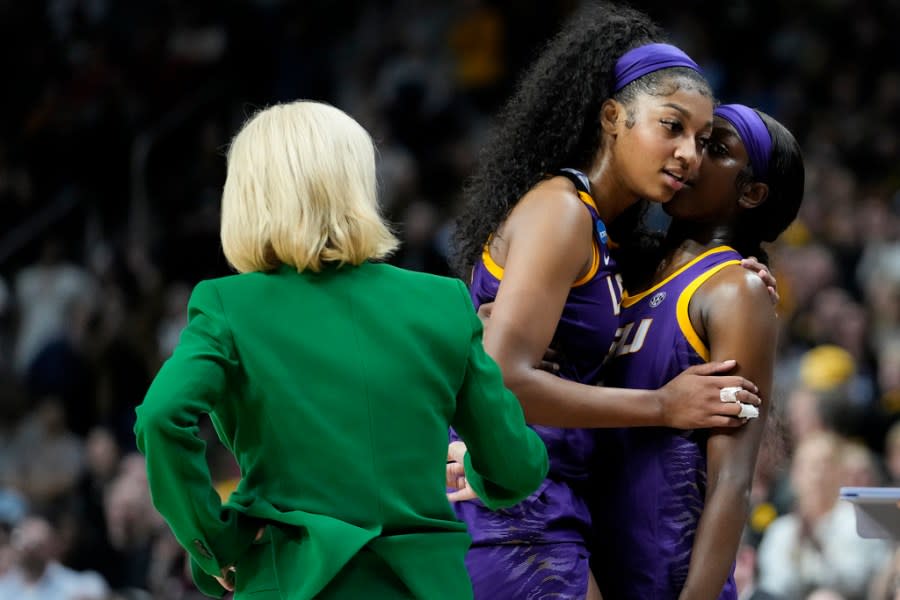 LSU forward Angel Reese (10) and LSU guard Flau’jae Johnson (4) talk as Reese leaves the court during the fourth quarter of an Elite Eight round college basketball game during the NCAA Tournament, Monday, April 1, 2024, in Albany, N.Y. (AP Photo/Mary Altaffer)