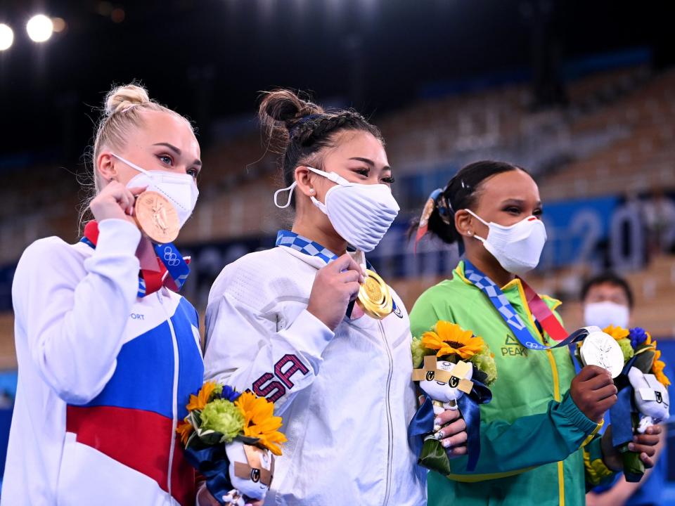 The women's gymnastics individual all-around medalists pose with their new hardware.