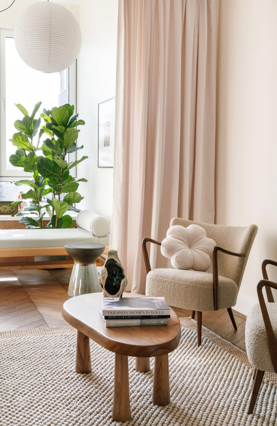 Seating area with boucle chairs and wooden table