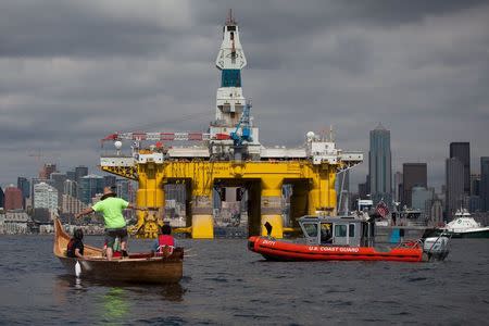 Members of the Duwamish Tribe protest against the Shell Oil Company's drilling rig Polar Pioneer as it arrives in Seattle, Washington, May 14, 2015. REUTERS/Matt Mills McKnight