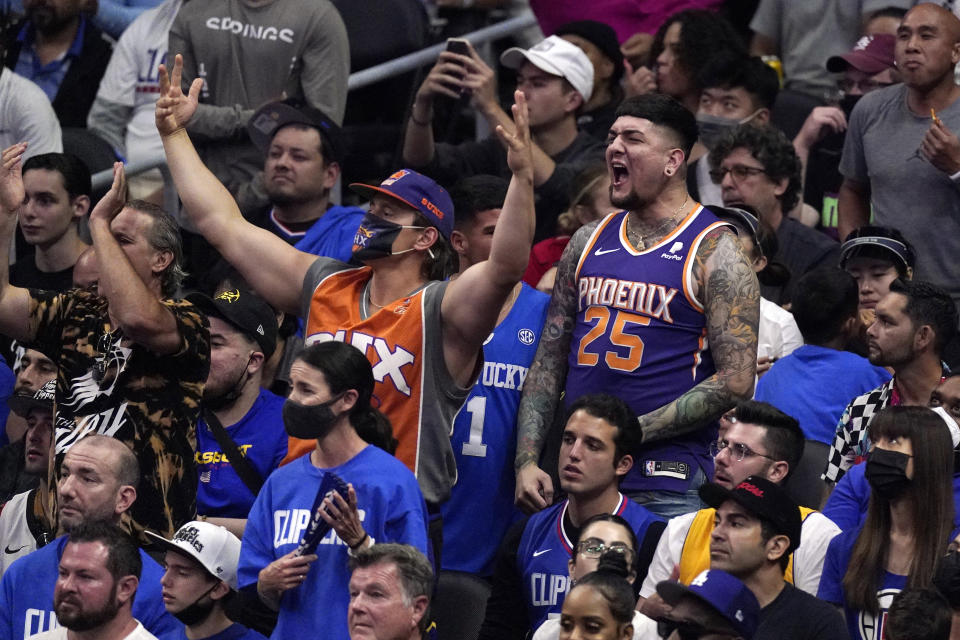 Phoenix Suns fans cheer during the second half in Game 6 of the NBA basketball Western Conference Finals between the Los Angeles Clippers and the Suns Wednesday, June 30, 2021, in Los Angeles. (AP Photo/Mark J. Terrill)