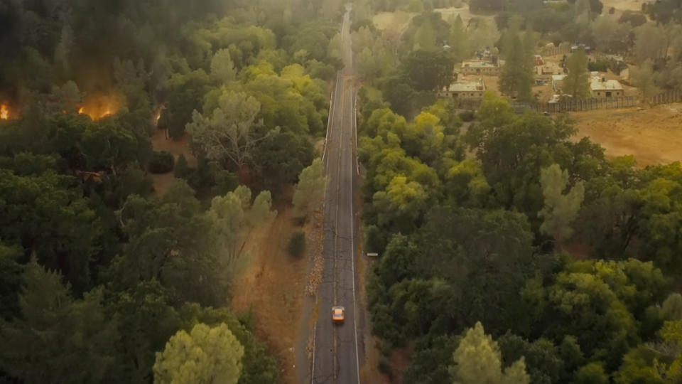 John Doe driving through the post-apocalyptic wasteland