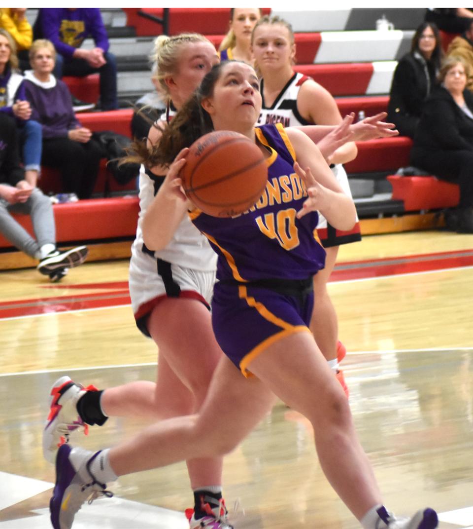Bronson's Veronica Bir (40) drives to the bucket for two points in the later stages of the Vikings District championship win on Friday