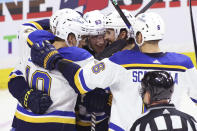 St. Louis Blues' Jake Neighbours (63) celebrates his goal against the Ottawa Senators with Brayden Schenn (10), Robert Thomas (18), Brandon Saad (20) and Marco Scandella (6) during the second period of an NHL hockey game Thursday, March 21, 2024, in Ottawa, Ontario. (Patrick Doyle/The Canadian Press via AP)