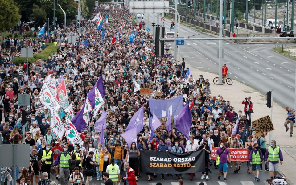 People take part in a protest for media freedom in Budapest on Friday