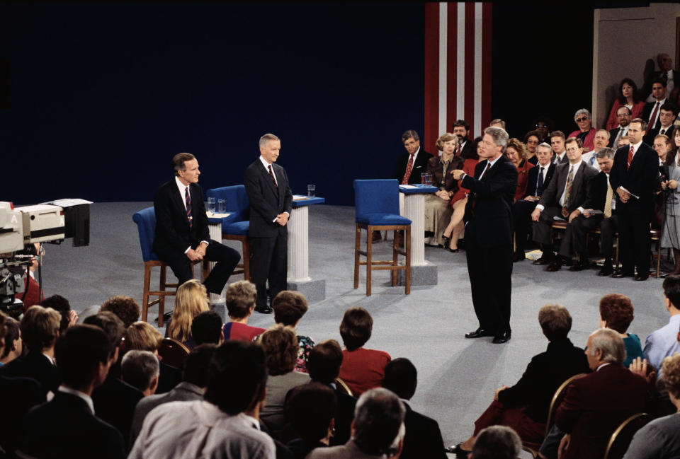 President Bush and Ross Perot listen to presidential candidate Bill Clinton speak during a presidential debate, 1992.<span class="copyright">Wally McNamee—Corbis via Getty Images</span>