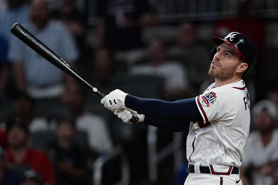 Atlanta Braves' Freddie Freeman watches his RBi sacrifice fly in the sixth inning of the team's baseball game against the Boston Red Sox on Tuesday, June 15, 2021, in Atlanta. (AP Photo/John Bazemore)