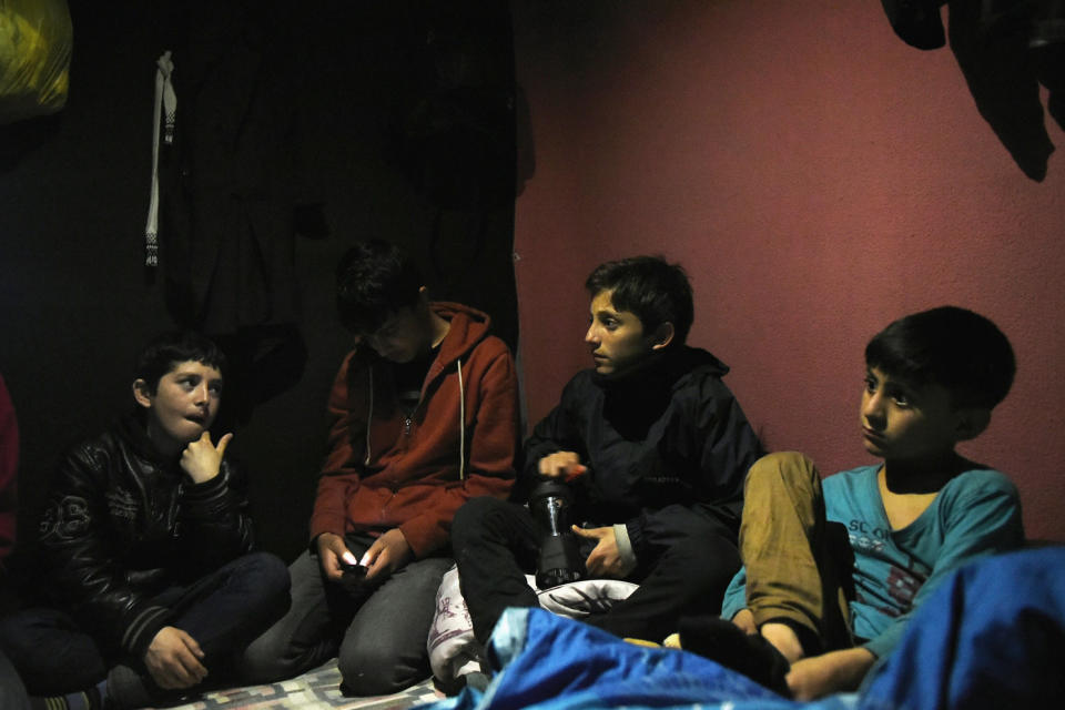 Children: Four young refugees from Afghanistan sit in a tent in The Jungle, Calais: Mary Turner/Getty Images