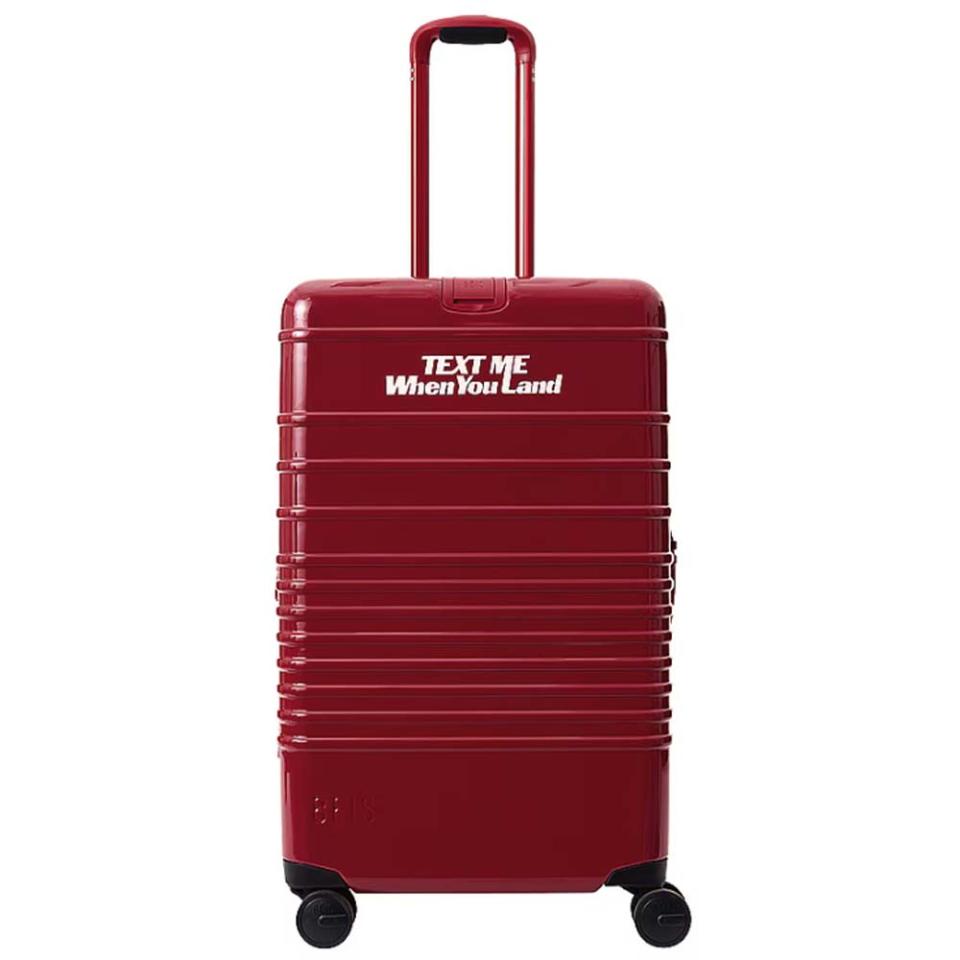 red medium suitcase