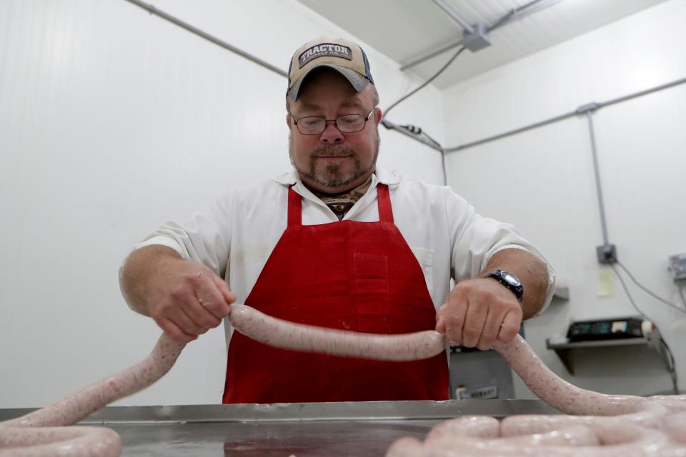 Johnston's Old Fashioned Meat Market meat processor John Jackson demonstrates how to make sausage during the 2019 Farm Tour Sunday, Oct. 13, 2019. 