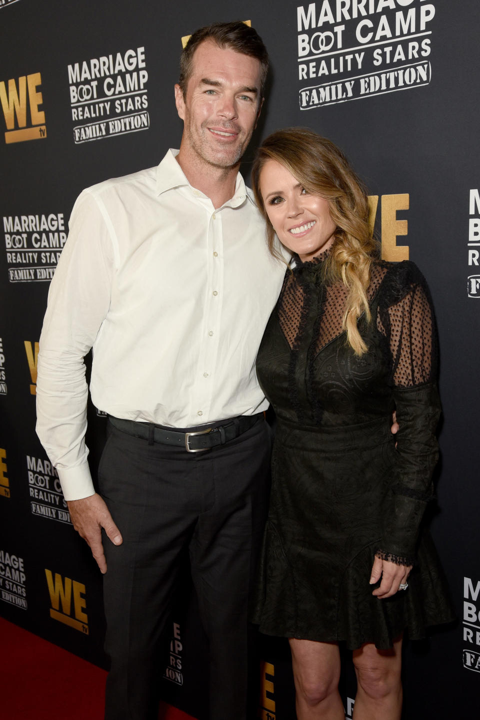 Trista and Ryan Sutter posing together at an event