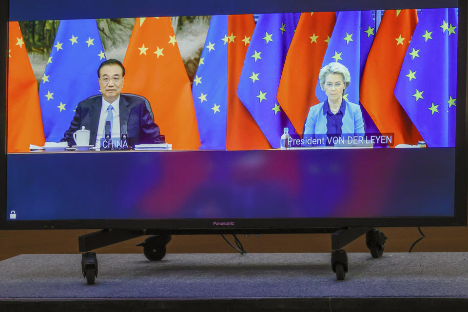 Chinese Premier Li Keqiang, left, and European Commission President Ursula von der Leyen speak via video-conference with European Council President Charles Michel, and European Union foreign policy chief Josep Borrell during an EU China summit at the European Council building in Brussels, Friday, April 1, 2022. (AP Photo/Olivier Matthys, Pool)
